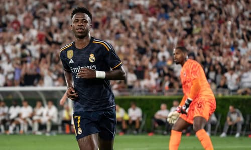 Vinicius Junior celebrates scoring against AC Milan for Real Madrid
