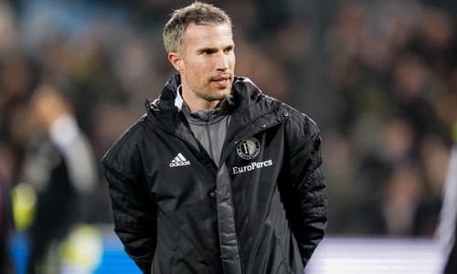 Robin van Persie working as a coach during a Feyenoord match.