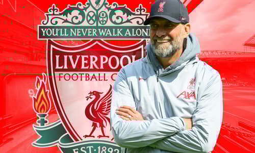 Jurgen Klopp and the Liverpool badge, in front of a panorama of Anfield in red