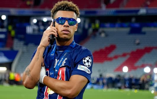 Desire Doue celebrates winning the Champions League with PSG