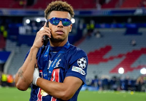 Desire Doue celebrates winning the Champions League with PSG