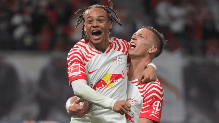 Xavi Simons celebrates a goal with Dani Olmo