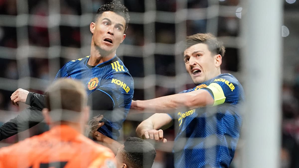 Cristiano Ronaldo and Harry Maguire leaping for the same ball at Man Utd.