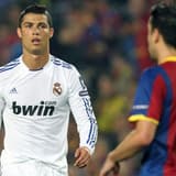 Cristiano Ronaldo and Xavi playing in El Clasico