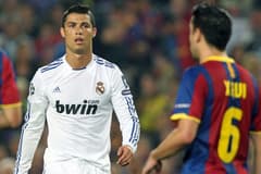 Cristiano Ronaldo and Xavi playing in El Clasico