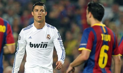Cristiano Ronaldo and Xavi playing in El Clasico