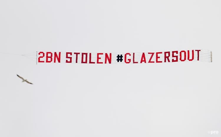 Man Utd fans with a banner protesting the ownership of the Glazers