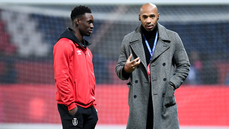 Folarin Balogun (left) with Thierry Henry (right)