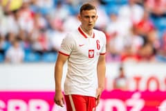 Kacper Kozlowski playing for Poland in a friendly against Iceland in 2021
