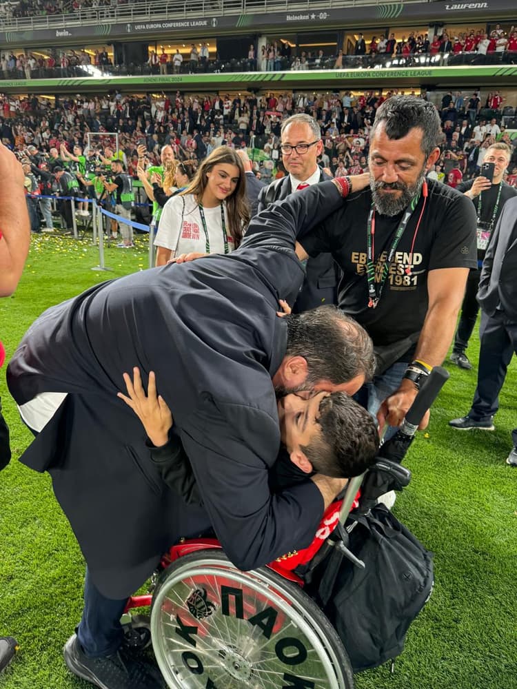 Marinakis and the supporter embrace