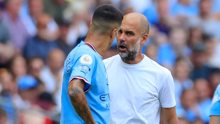 Joao Cancelo and Pep Guardiola