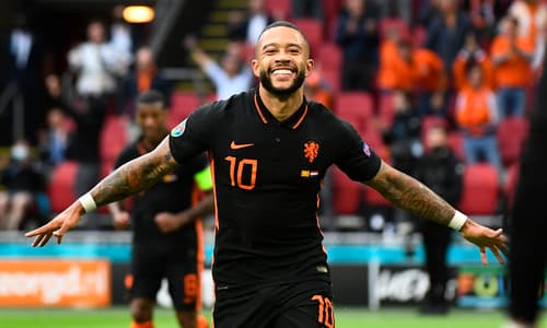 Barcelona attacker Memphis Depay celebrates scoring for the Netherlands at Euro 2020.
