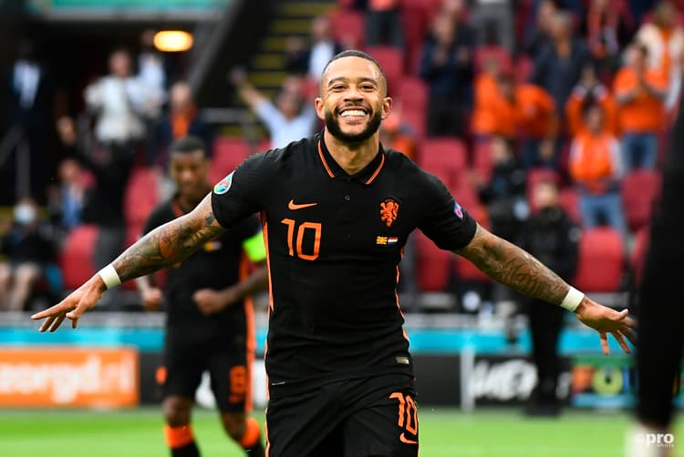 Barcelona attacker Memphis Depay celebrates scoring for the Netherlands at Euro 2020.