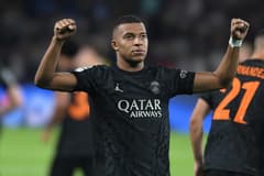 Kylian Mbappe celebrates scoring against Dortmund in the Champions League