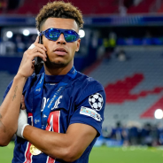 Desire Doue celebrates winning the Champions League with PSG