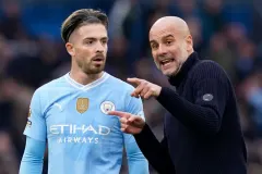 Pep Guardiola speaks to Jack Grealish after Man City draw 0-0 with Arsenal in the Premier League