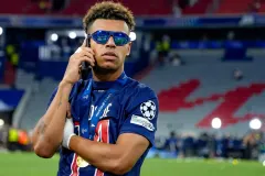 Desire Doue celebrates winning the Champions League with PSG