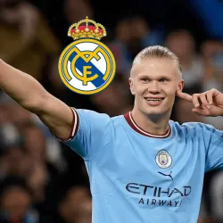 Erling Haaland of Manchester City with the Real Madrid badge