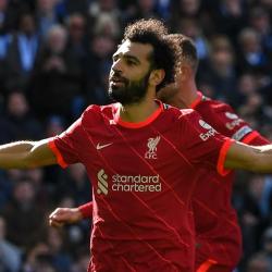 Mo Salah celebrates scoring against Brighton for Liverpool