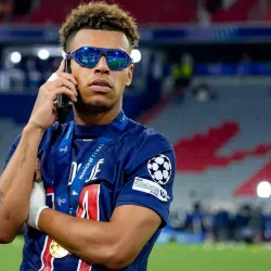 Desire Doue celebrates winning the Champions League with PSG