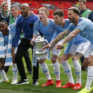 Manchester City players with the FA Cup.