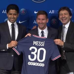 Lionel Messi at his PSG presentation with Nasser Al-Khelaifi and Leonardo