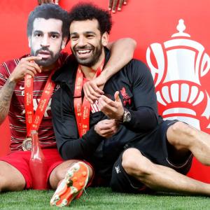 Mohamed Salah and Thiago Alcantara celebrate winning the 2022 FA Cup final with Liverpool