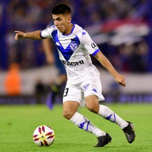 Thiago Almada carries the ball for Velez in a match in the 2019/20 season.