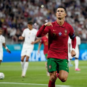 Juventus star Cristiano Ronaldo celebrates equalling Ali Daei's record for international goals for Portugal against France at Euro 2020.