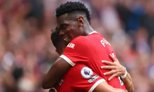 Paul Pogba celebrates with Man Utd team-mate Bruno Fernandes during a 5-1 win over Leeds