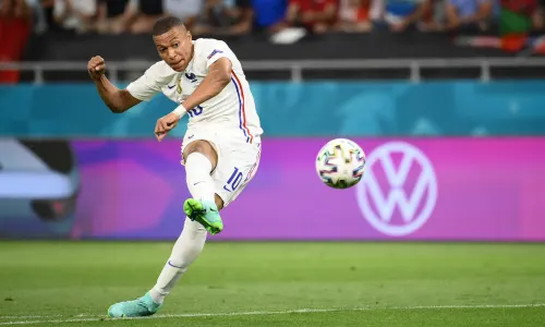 PSG striker Kylian Mbappe shoots towards goal in France's Euro 2020 match with Portugal