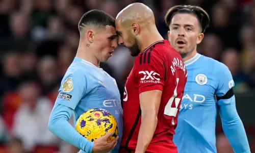 Phil Foden and Sofyan Amrabat clash in the Manchester derby