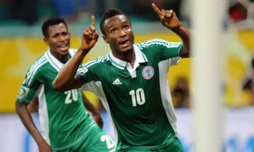 Chelsea midfielder Mikel Jon Obi celebrates scoring for Nigeria