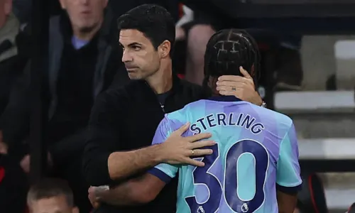 Arsenal's Raheem Sterling is consoled by Mikel Arteta after being replaced against Bournemouth