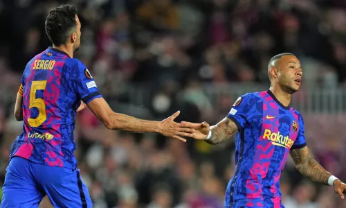 Busquets and Memphis in action for Barcelona.