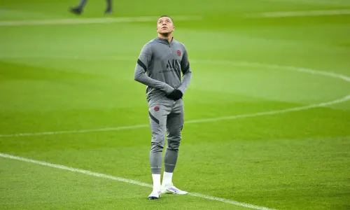 Kylian Mbappe looks at Real Madrid's Bernabeu stadium