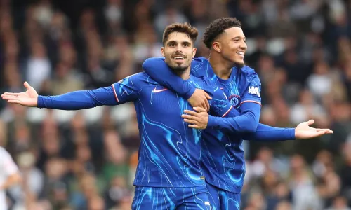 Pedro Neto and Jadon Sancho of Chelsea celebrate scoring against Fulham in the Premier League, 2024/25