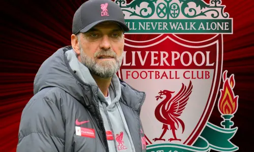 Jurgen Klopp and the Liverpool badge on a red and black abstract background
