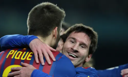 Lionel Messi and Gerard Pique celebrating for Barcelona