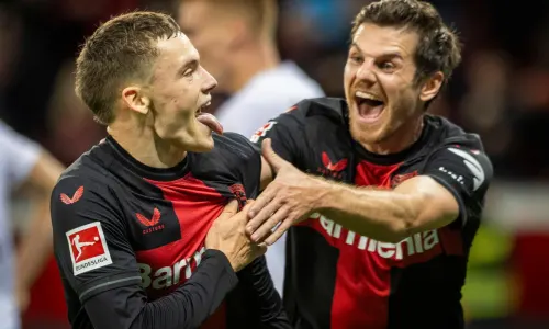 Florian Wirtz and Jonas Hofmann celebrate scoring for Bayer against Freiburg