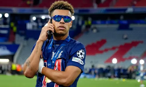 Desire Doue celebrates winning the Champions League with PSG