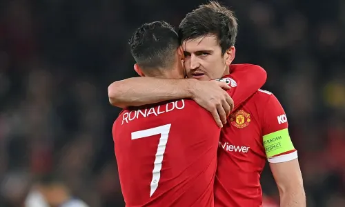 Cristiano Ronaldo and Harry Maguire in action for Man Utd.
