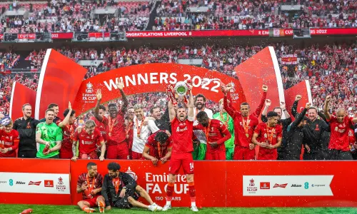 Liverpool lift the FA Cup trophy after defeating Chelsea on penalties.
