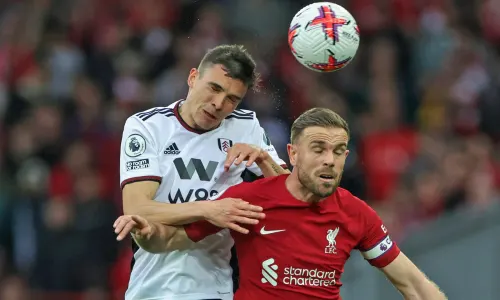 Joao Palhinha and Jordan Henderson competing for possession.