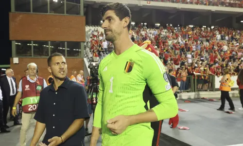 Thibaut Courtois leaving the pitch with Eden Hazard at the end of the match after playing for Belgium