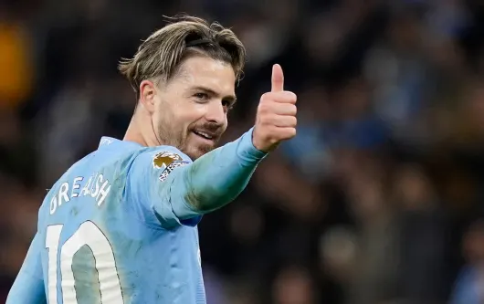 Jack Grealish gives the thumbs up during Man City's Premier League match with Aston Villa