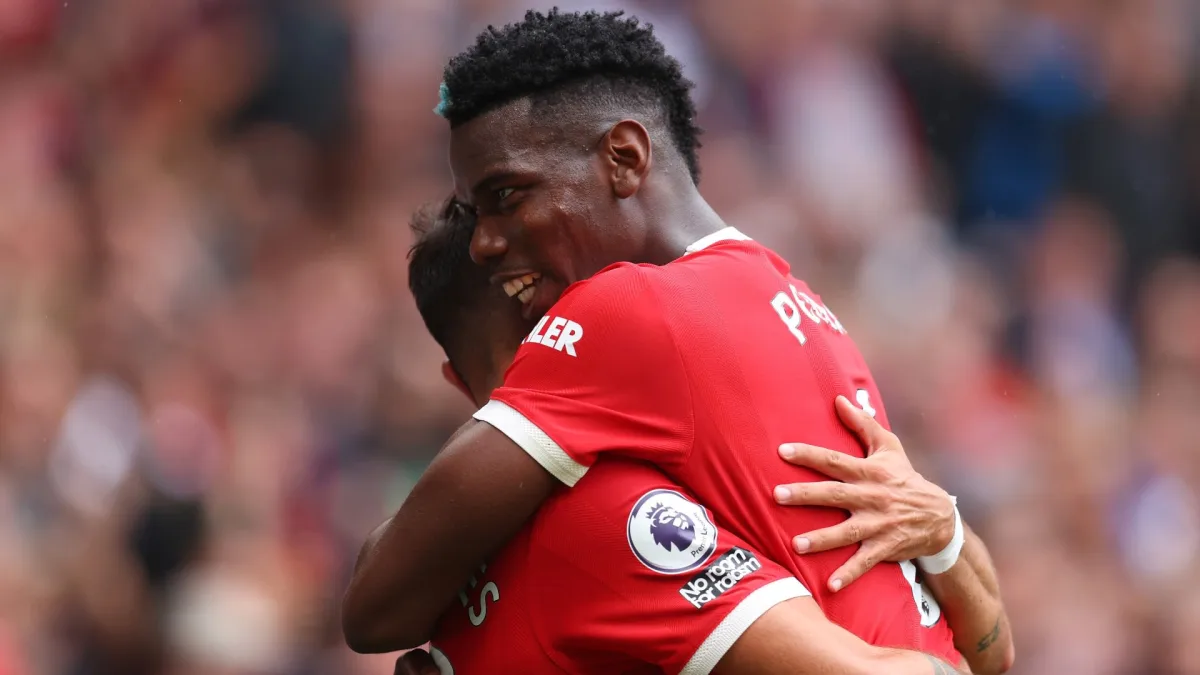 Paul Pogba celebrates with Man Utd team-mate Bruno Fernandes during a 5-1 win over Leeds