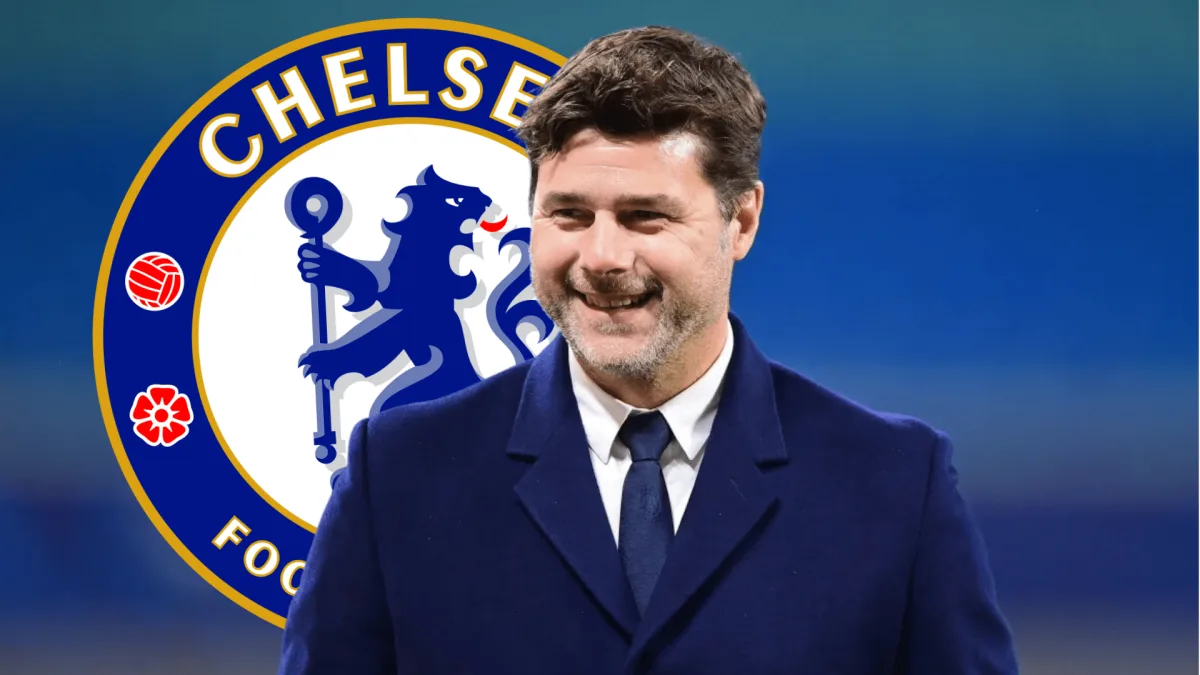 Smiling Mauricio Pochettino in front of Chelsea badge