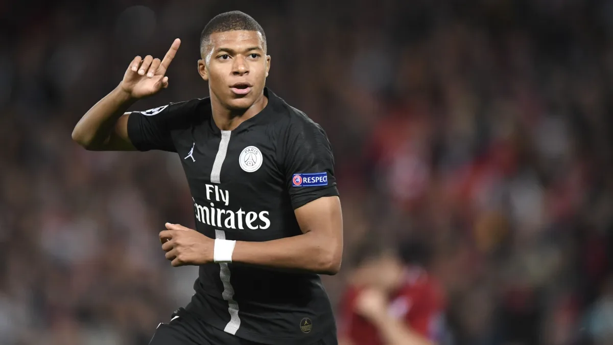 Kylian Mbappe celebrates scoring against Liverpool