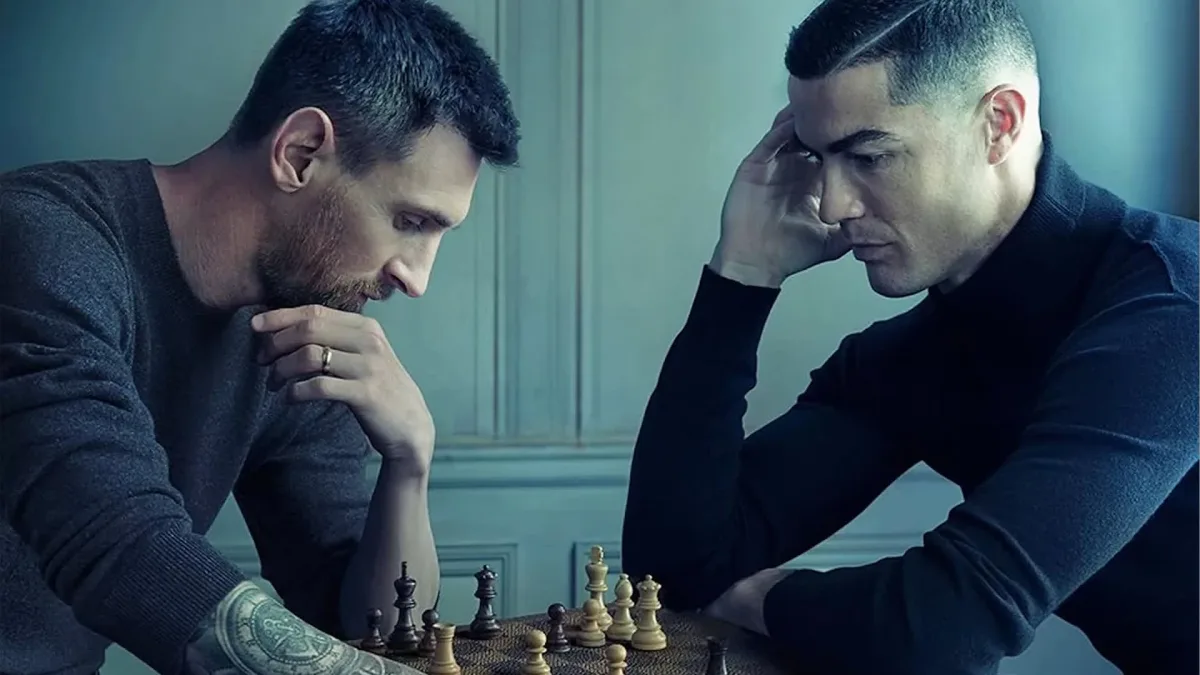 Lionel Messi and Cristiano Ronaldo playing chess.